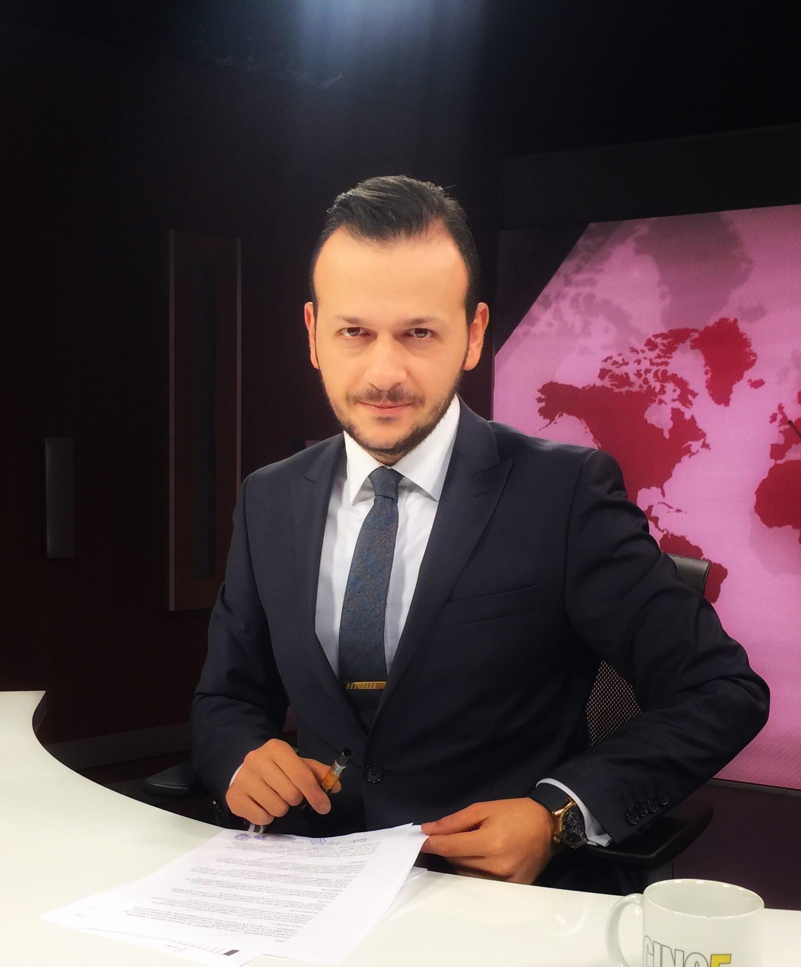 Yusuf Baykal Bozkurt at the news desk